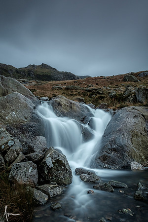 Small waterfall with its source, Glyder fawr, in the distance