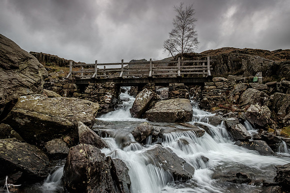 Footbridge and falls at the beginning of the path to Llyn Idwal from Idwal cottage